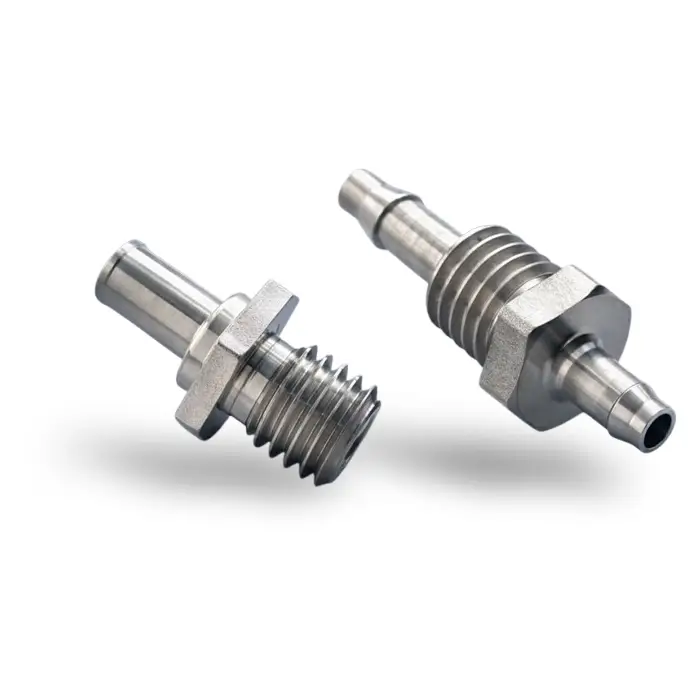Custom threaded fittings with barbed shafts manufactured via high precision CNC machining solutions.